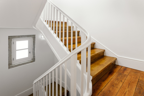 wooden staircase with White Wooden grill design