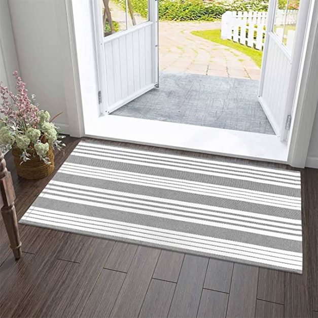 grey and white Floor Mat at the entrance door of the house