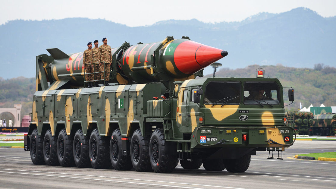 Pakistani army soldiers travel on a vehicle carrying a long-range ballistic Shaheen II missile during the Pakistan Day parade in Islamabad