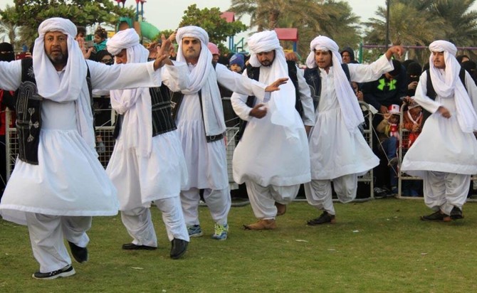 baloch men dancing wearing cultural dresses