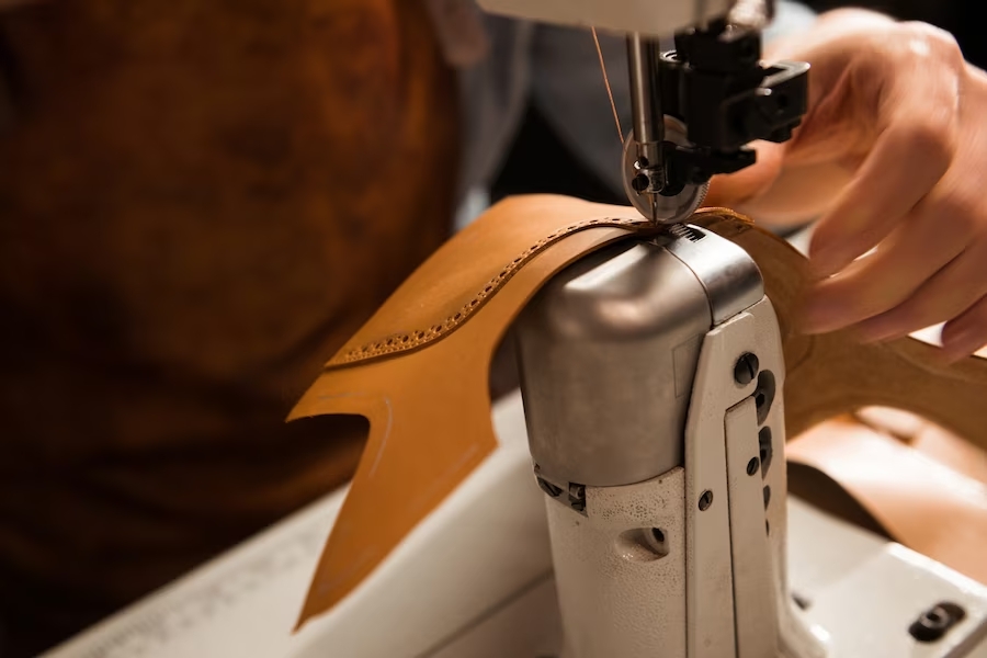 close-up-cobbler-stitching-part-shoe