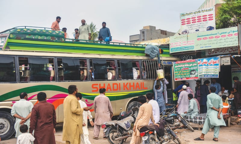 people getting on the bus