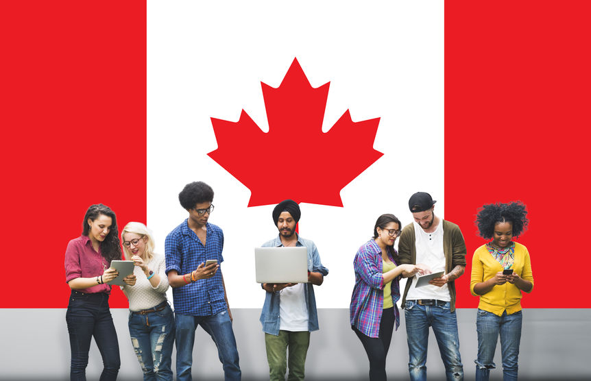 people standing in front of canadian flag