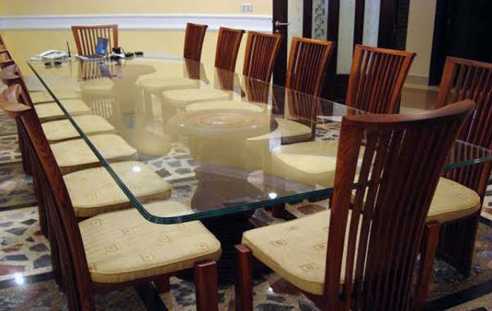 tradional dining chairs and a glass table