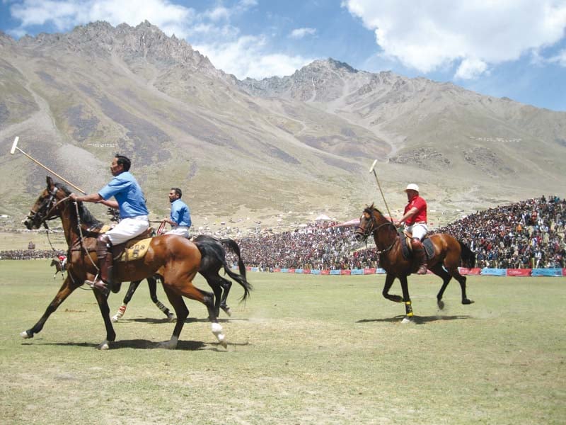 horse riders playing polo at shandur valley