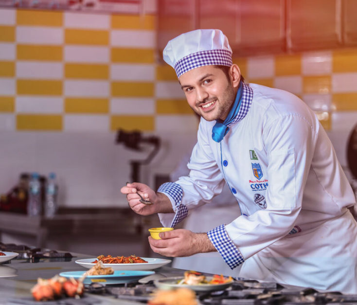 A student preparing plate at COTHM Lahore