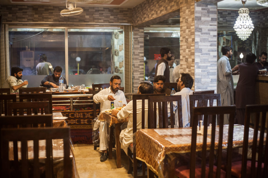 People eating inside Kabul Restaurant Islamabad