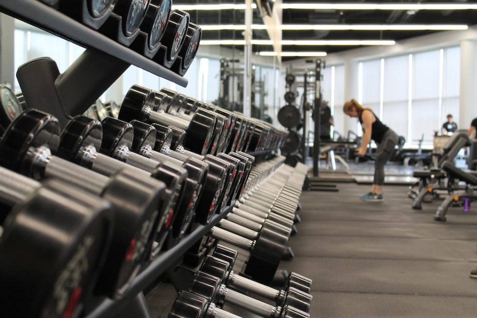 dumbbells aligned in a gymnasium