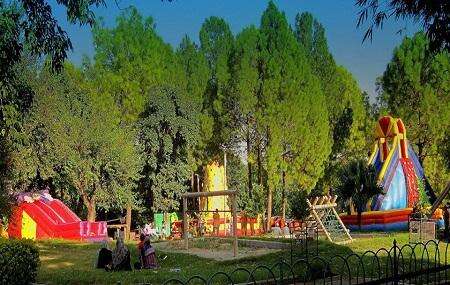 rides for Children in Japanese Park Islamabad covered with trees