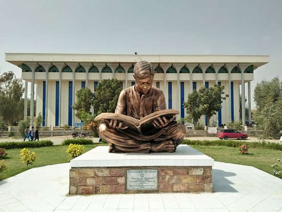 a statue in the entrance of University of Sindh