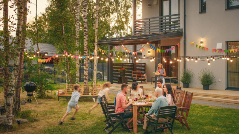 a family is having dinner at garden