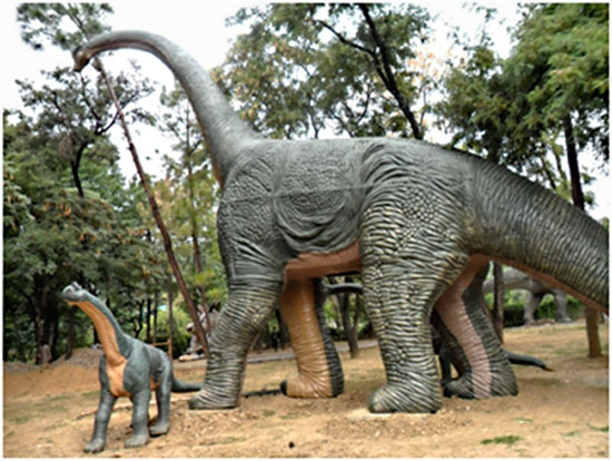 life-size statues of dianosours in dino park islamabad