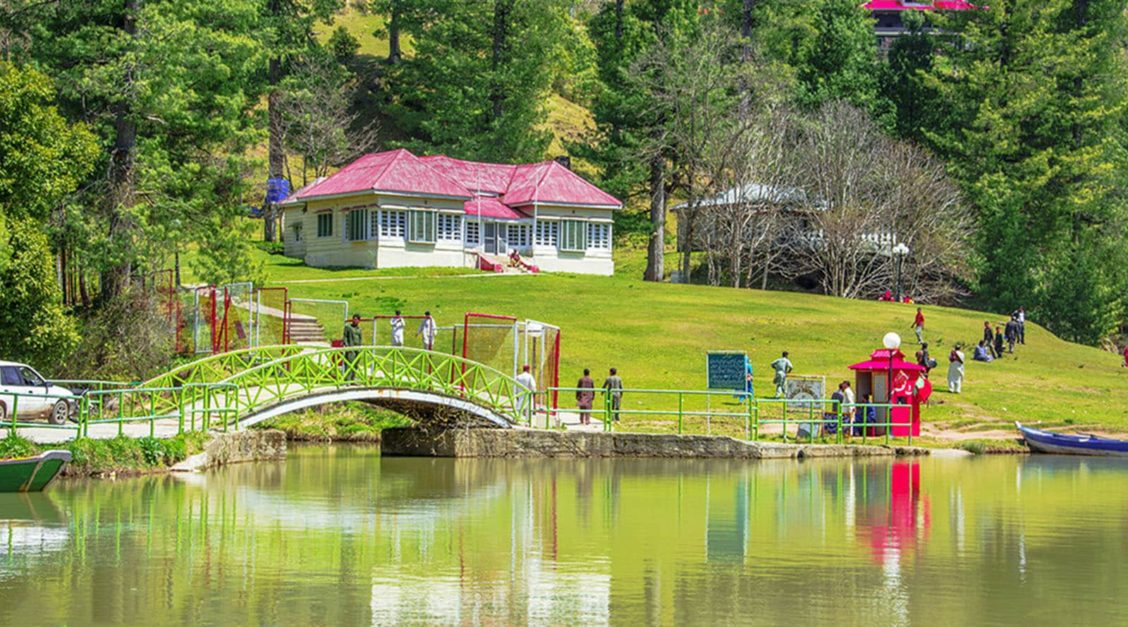 Green resort and nearby lake in Rawalakot