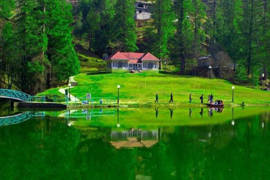 Green resort and nearby lake in Rawalakot