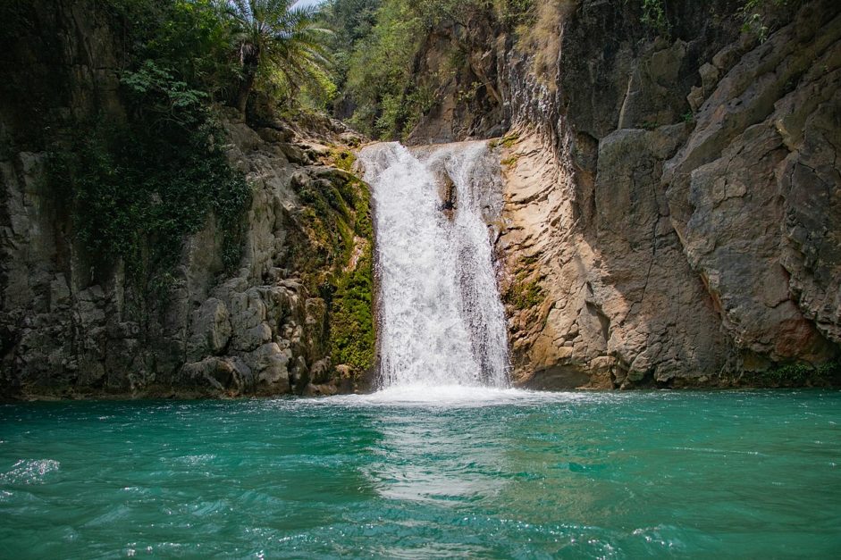 Noori waterfall surrounded by rocky cliff