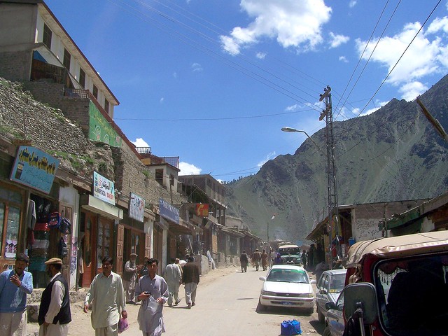 locals walking in a street somewhere in astore valley