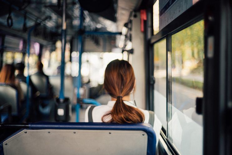 woman seated in a bus