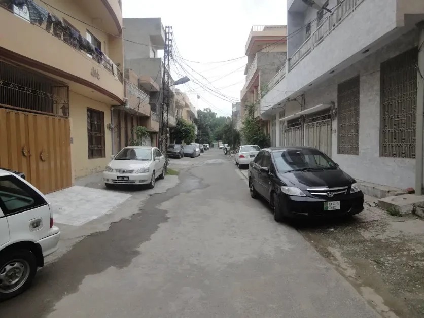 Car parked outside houses in a street of C Block of Gulshan e Ravi