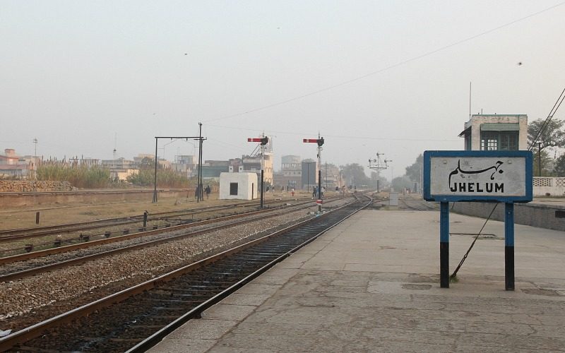 a train station with jhelum name board