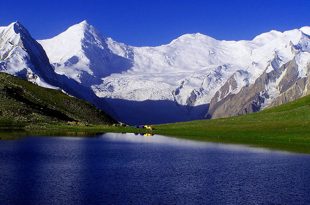 Rush lake with the background of mountain covered with glaciers