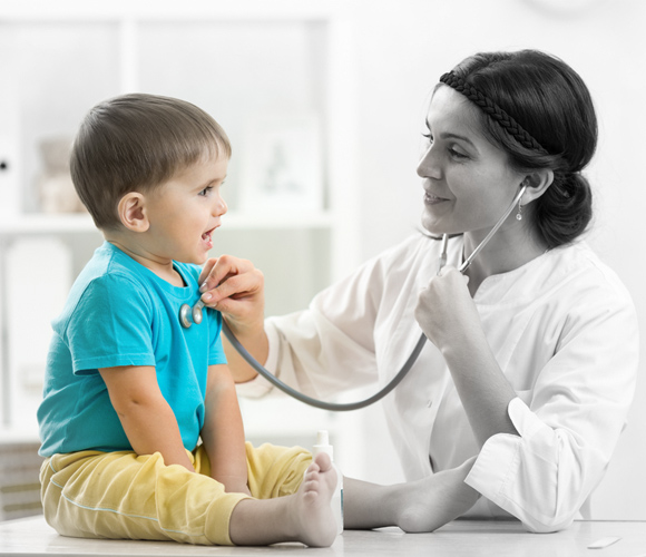 a doctor doing checking up a baby in hospital