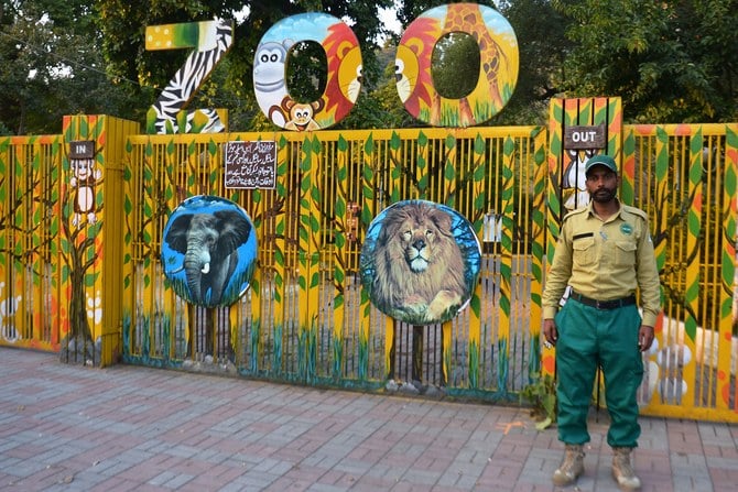 a guard standing outside the zoo