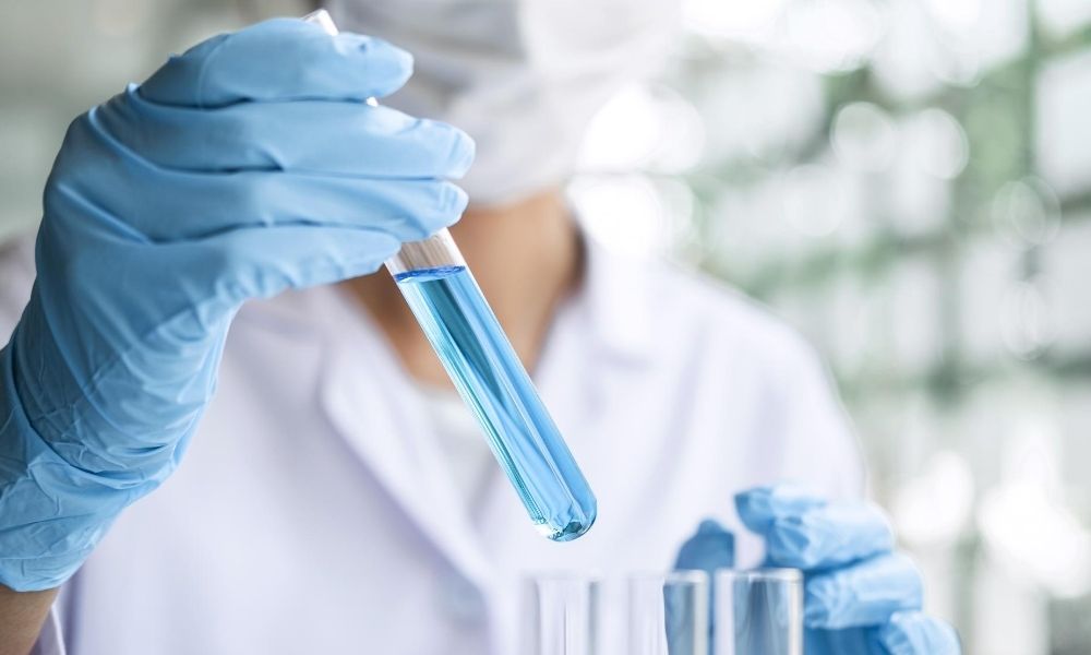 a lab technician holding a test tube