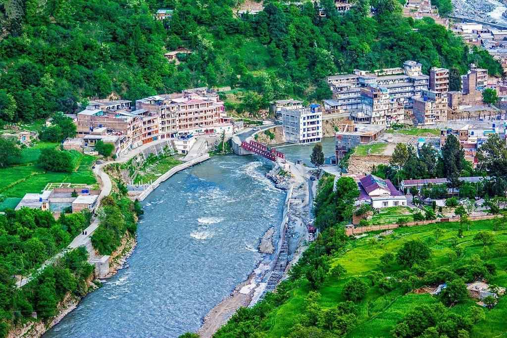 a stream flowing through the valley of swat