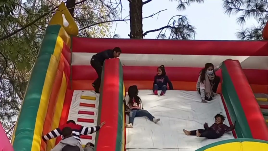 kids playing at a jumping castle