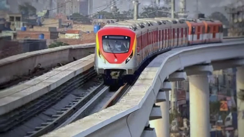 the orange line metro train on the track 