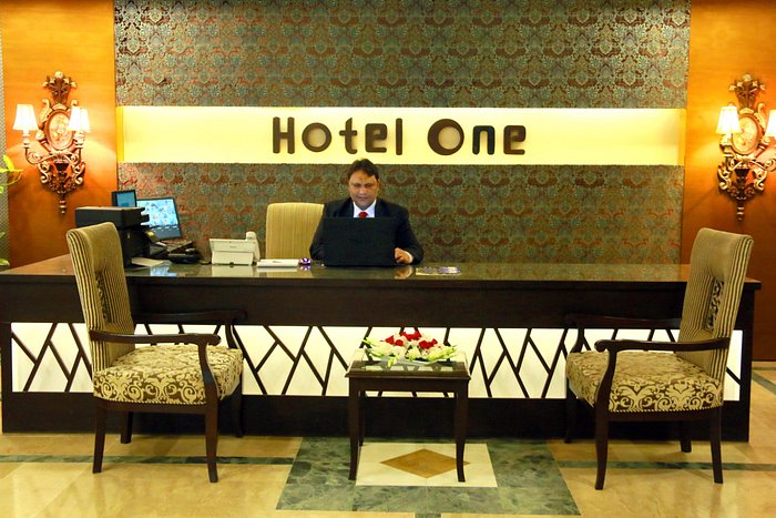 a hotel staff at the reception of Hotel One Abbottabad