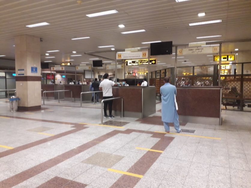 Passengers standing at Airport terminal