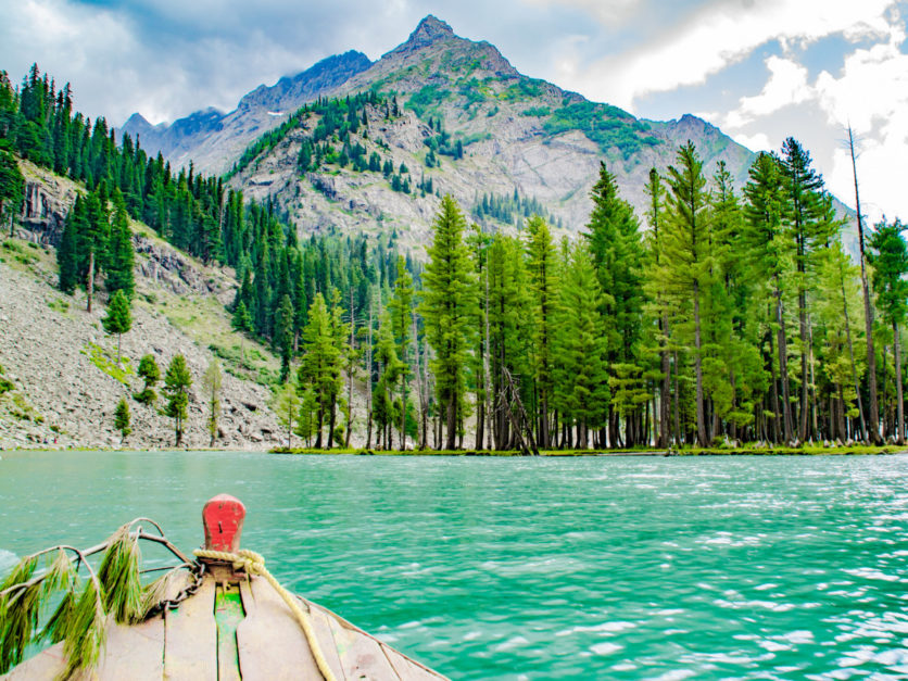 Sea green water of Mahodand Lake covered with trees and mountains