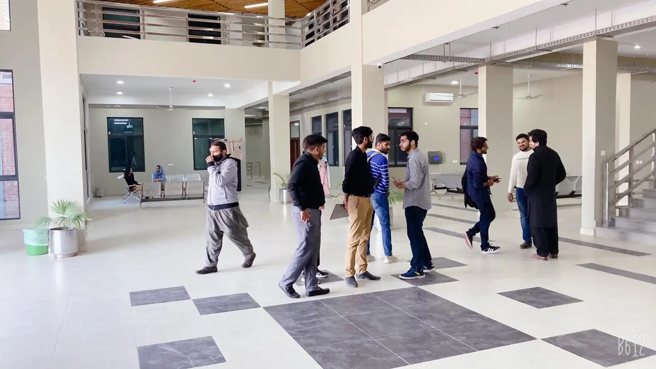 students standing inside campus 