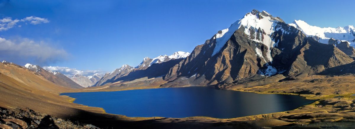 Karambar Lake covered with moutain peaks