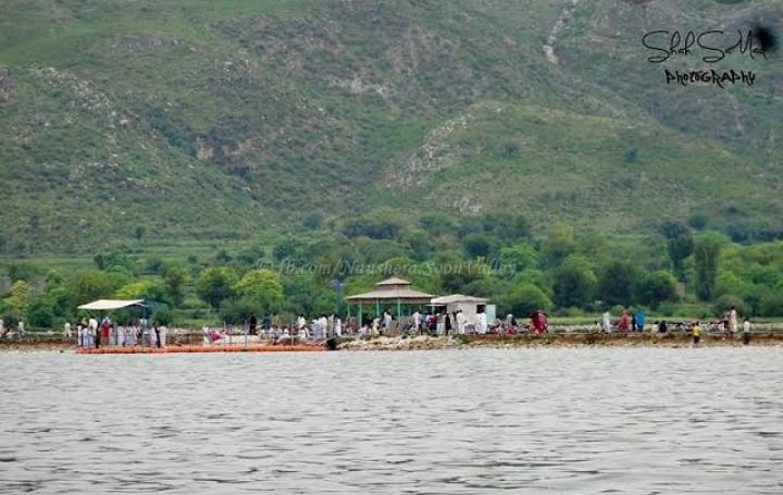 khabiki lake with green mountain in the rear view