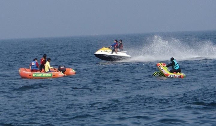 tourist doing jet ski and boat rides at Hawkes Bay beach