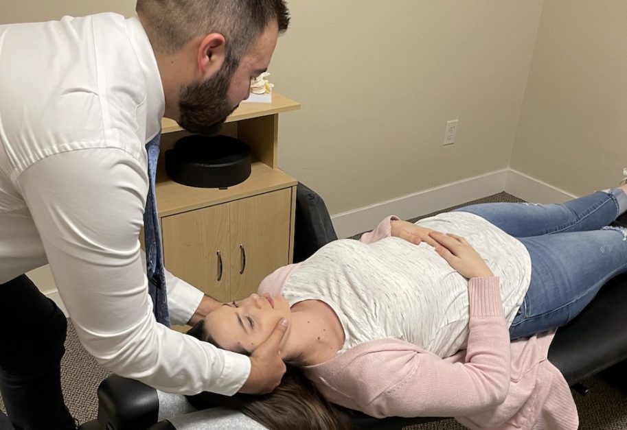 Chiropractor treating Headache and Migraine issue of a patient