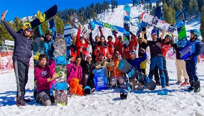 Participants posing for a picture at International Snowboarding Championship in Malam Jabba