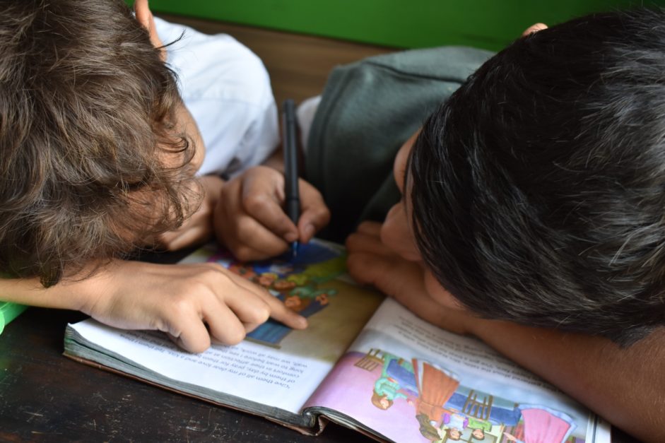 kids writing on a paper