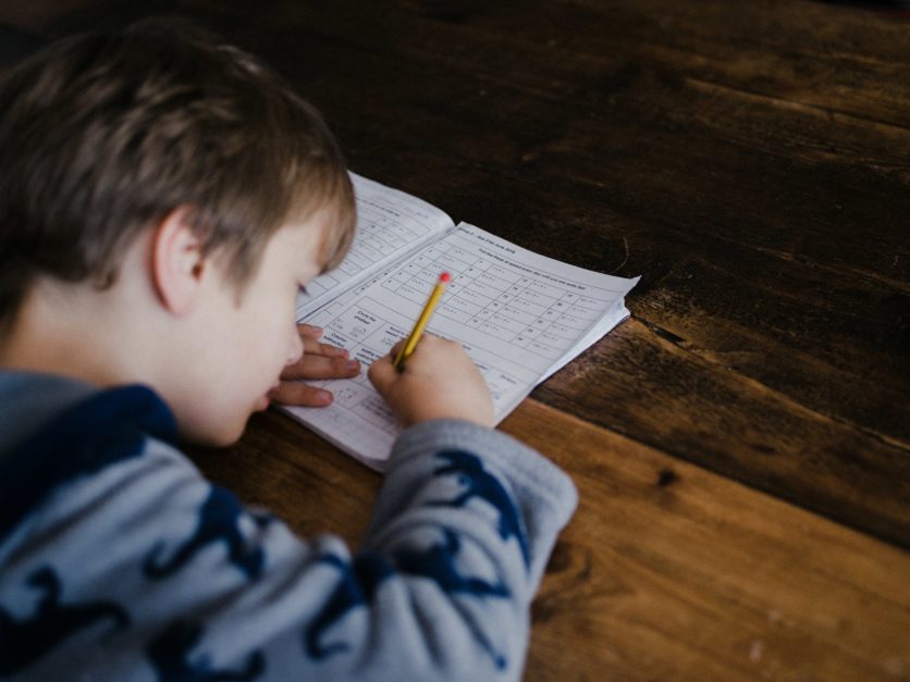 Kid solving paper