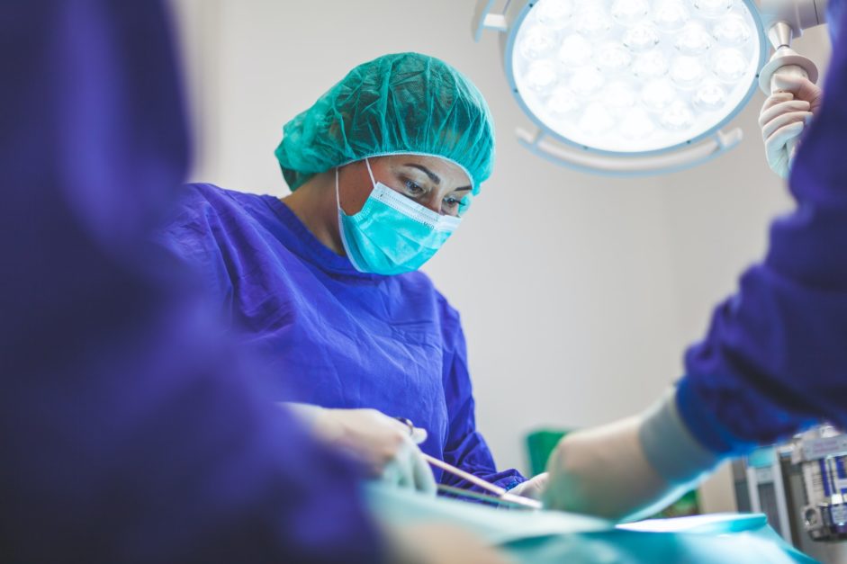 female doctor performing surgery