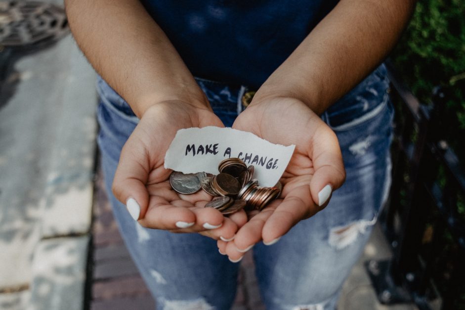 kid holding coins in hand