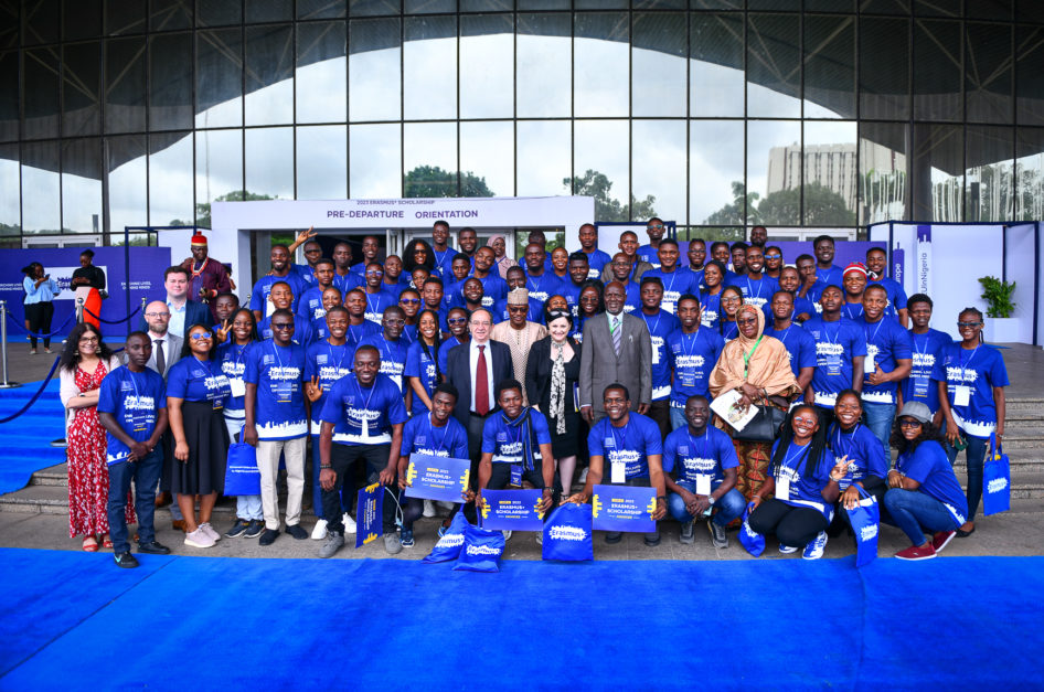 students holding erasmus plus placards for a group photo