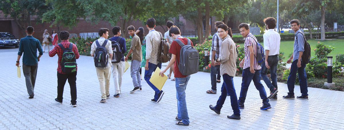 university students walking in to their class 