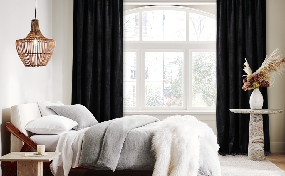 black velvet curtains hung in a bedroom