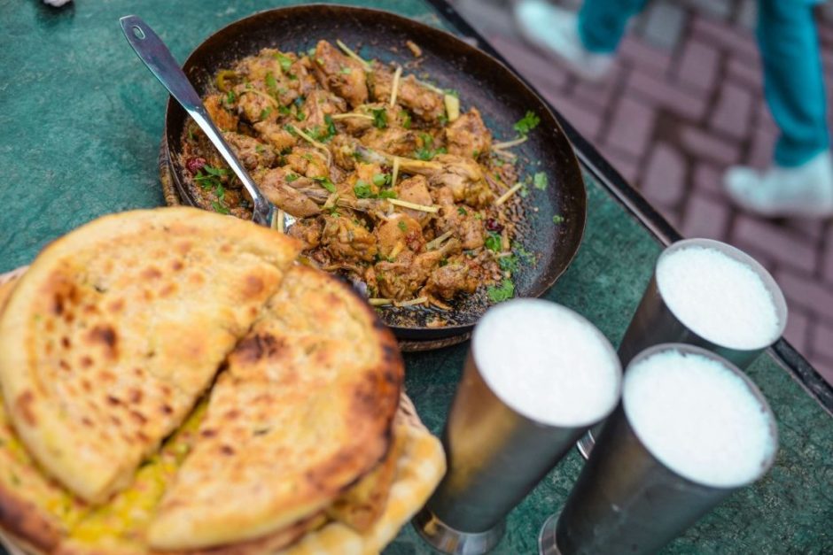 karahai with nan and lassi served on table