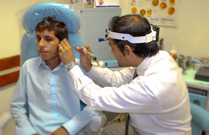 Ear specialist checking patient