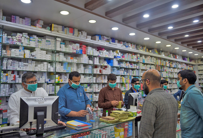 Customers and salesman in a pharmacy