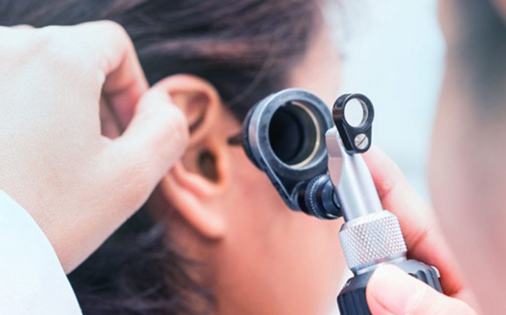 ear specialist diagnosing a patient